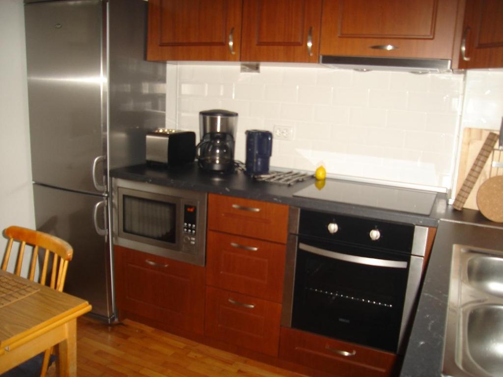 A kitchen or kitchenette at Bulhotel Pritzker Apartment