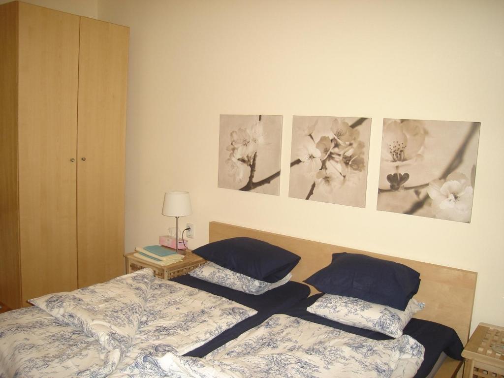 A bed or beds in a room at Bulhotel Pritzker Apartment