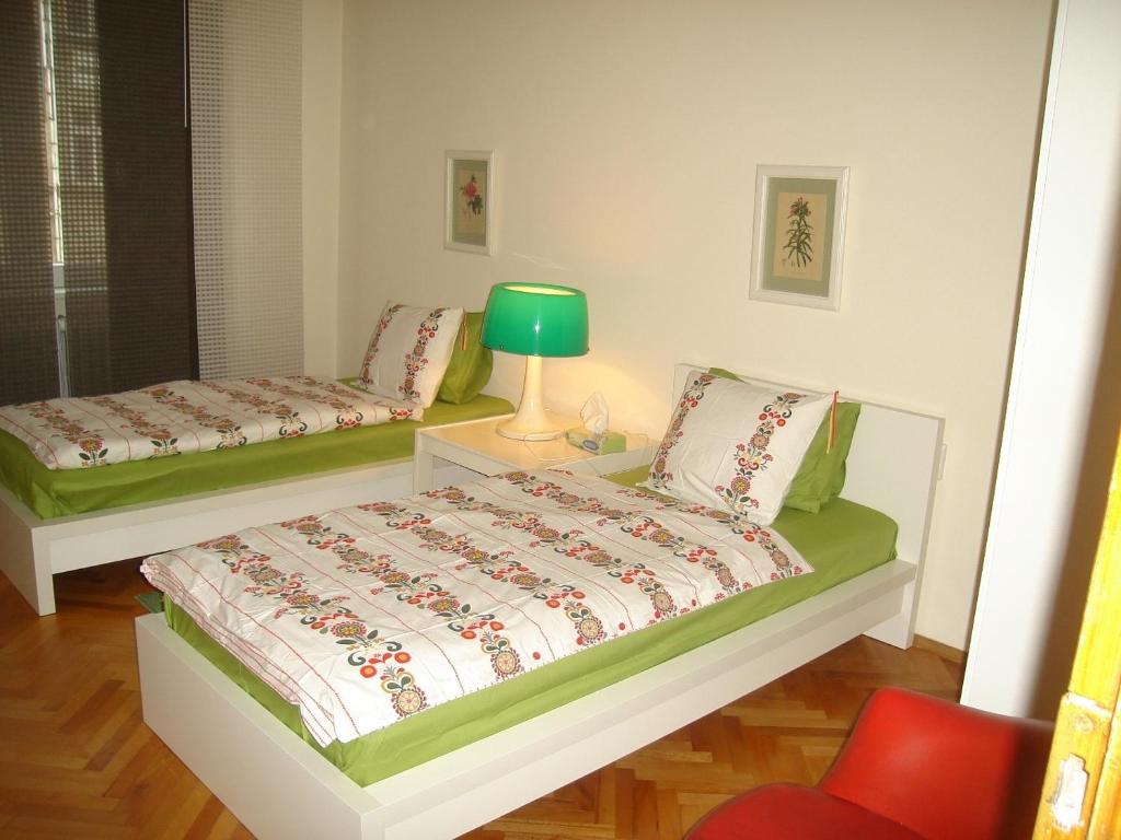 A bed or beds in a room at Bulhotel Pritzker Apartment