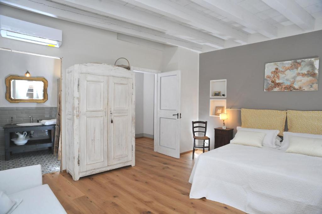 Postel nebo postele na pokoji v ubytování Casa Lumaca