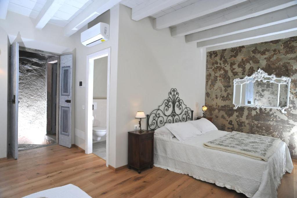 Postel nebo postele na pokoji v ubytování Casa Lumaca