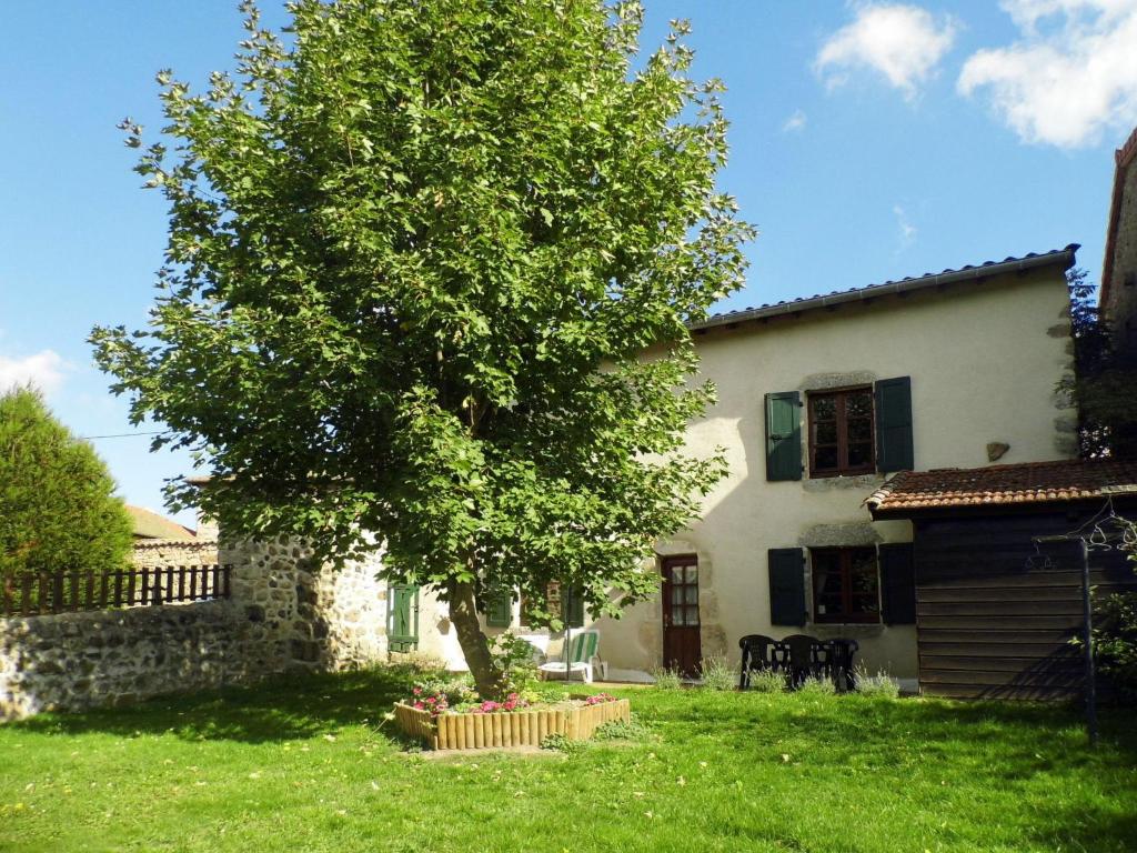 a tree in the yard of a house at Holiday Home Le Haut d'Ancette - AJA100 by Interhome in Saint-Julien-dʼAnce