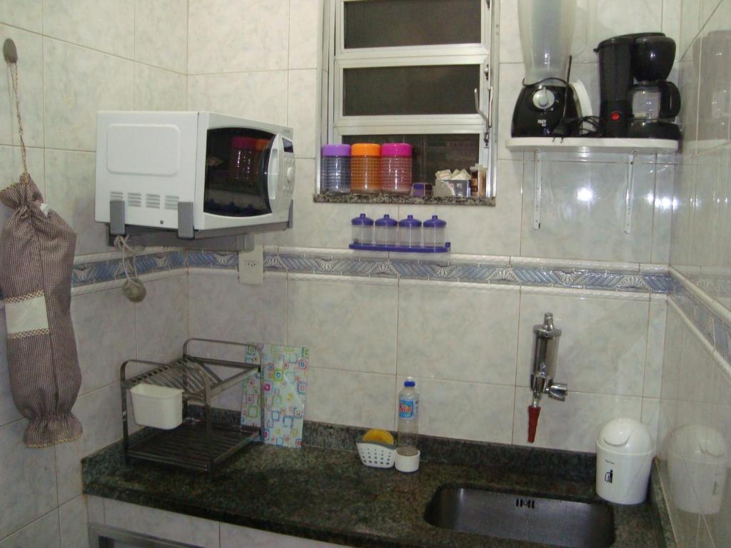 Ein Badezimmer in der Unterkunft Apart Marcelo - Lapa/Rezende