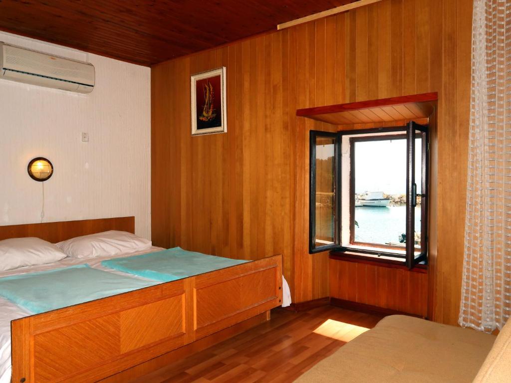 Postel nebo postele na pokoji v ubytování Holiday Home Delfar by Interhome