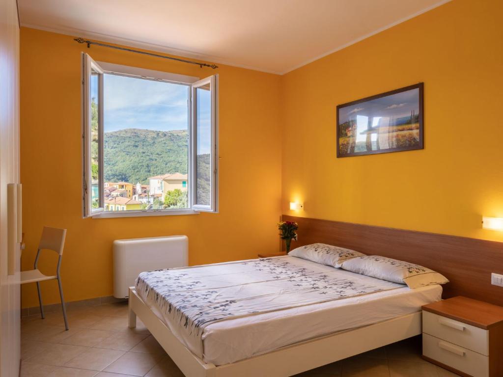 A bed or beds in a room at Apartment Arancia - PTB153 by Interhome