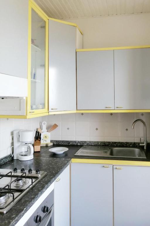 A kitchen or kitchenette at Apartment Joly - SLR111 by Interhome