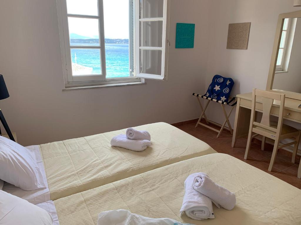 Postel nebo postele na pokoji v ubytování A Hotel Faros
