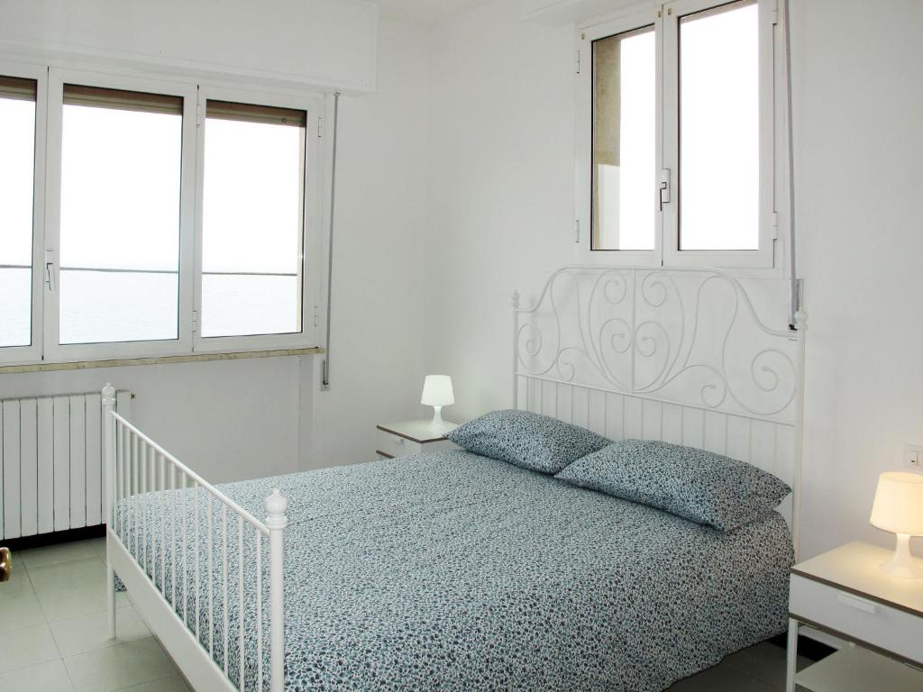 A bed or beds in a room at Holiday Home Giorgia - BGB100 by Interhome