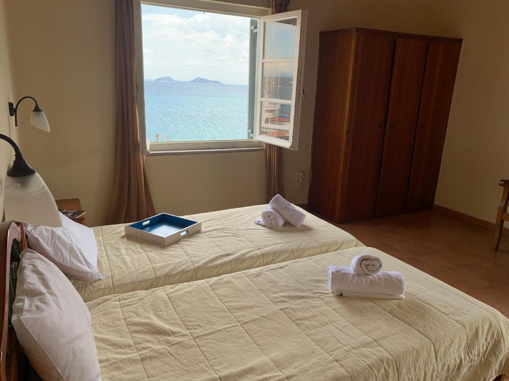 Postel nebo postele na pokoji v ubytování A Hotel Faros