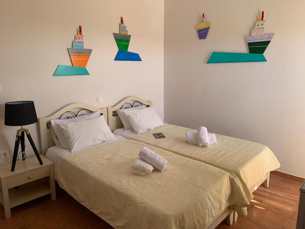 Postel nebo postele na pokoji v ubytování A Hotel Faros