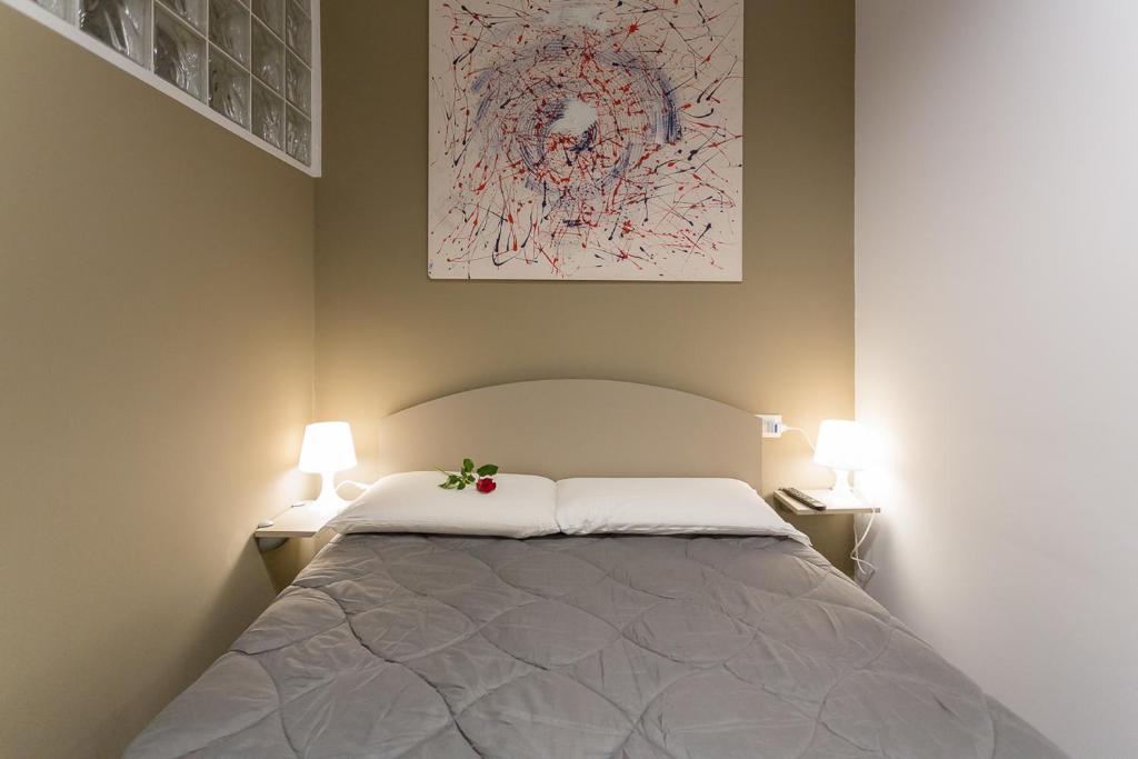 Łóżko lub łóżka w pokoju w obiekcie HH Hermoso Housing ALESSANDRIA
