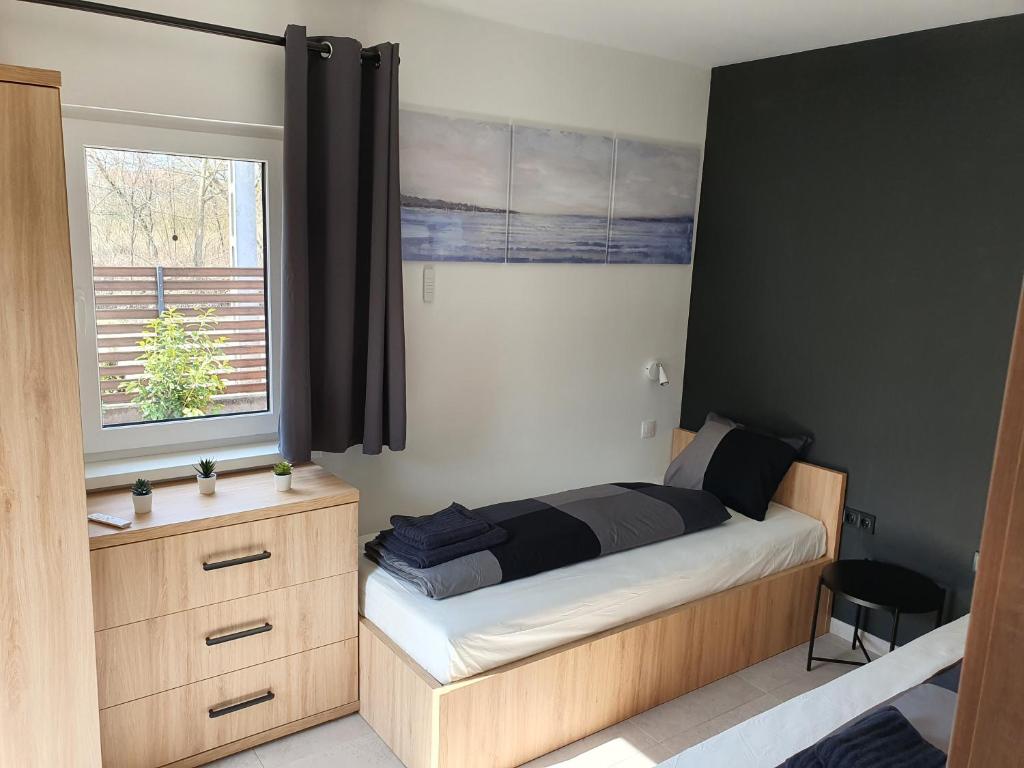 Postel nebo postele na pokoji v ubytování H&H Apartments Poroszló