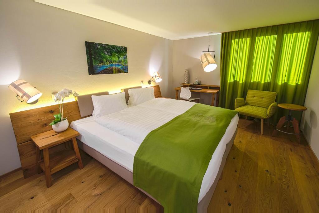 Postel nebo postele na pokoji v ubytování Hotel National