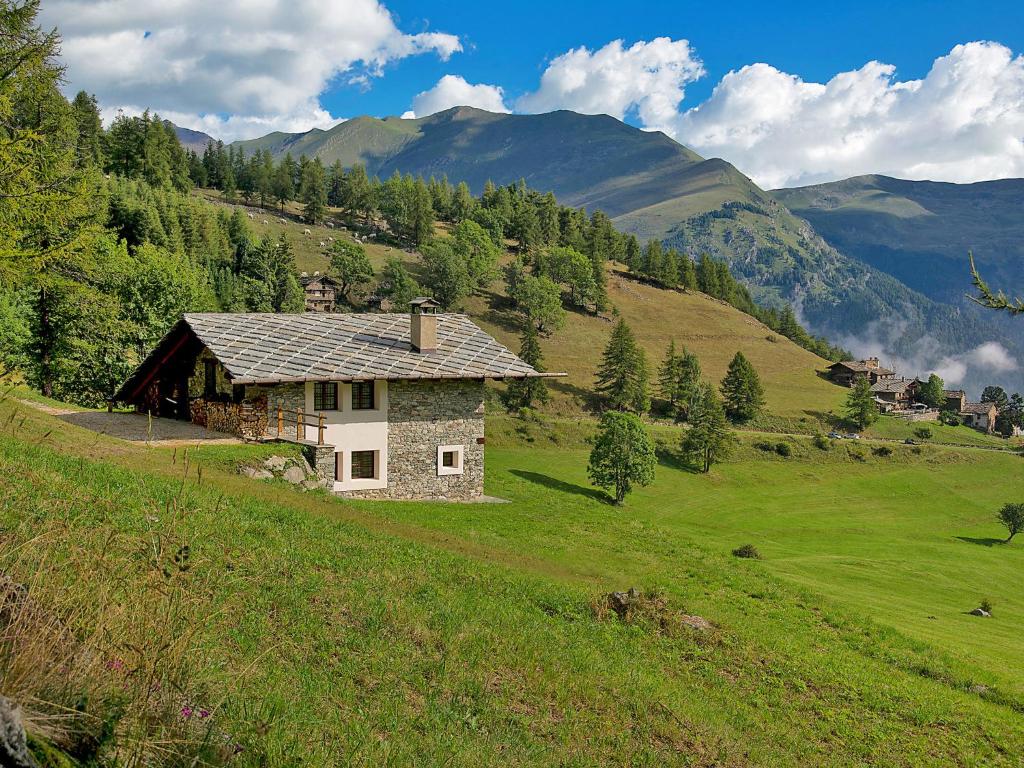 a house on a hill in a green field at Chalet Casot Pra La Funt by Interhome in Sampeire