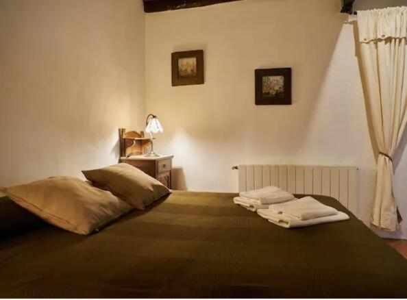 Postel nebo postele na pokoji v ubytování Masia Olivera