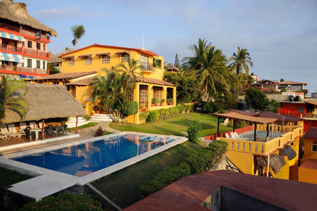 an aerial view of a resort with a swimming pool at Villa Casalet in Puerto Escondido