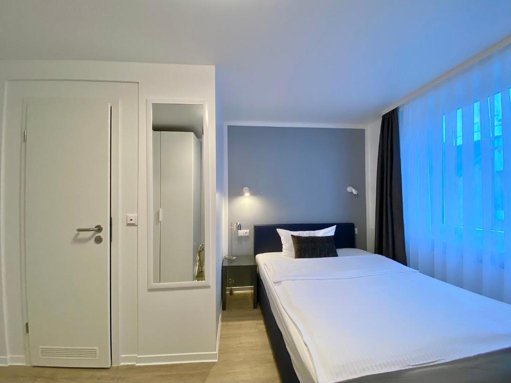 Postel nebo postele na pokoji v ubytování Rußmann Hotel & Living