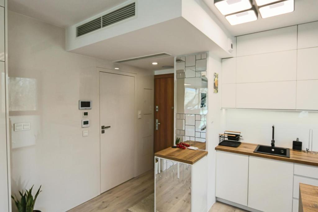 Kuchyňa alebo kuchynka v ubytovaní Apartament Unia 12 Basen&SPA