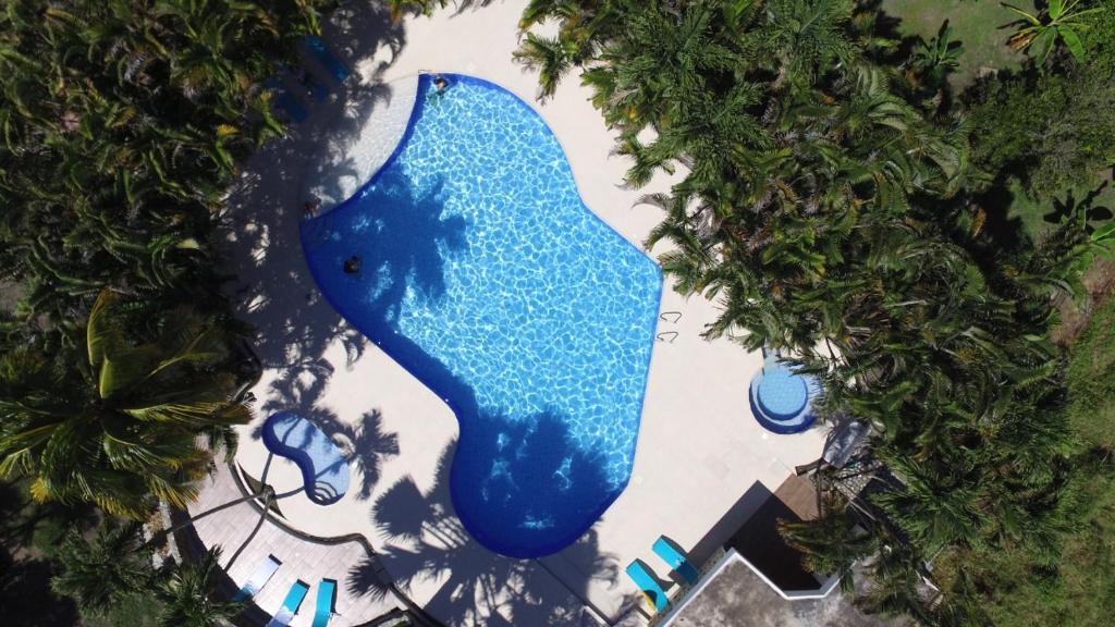 an aerial view of a large blue fountain at Hotel spa Excalibur in Villeta