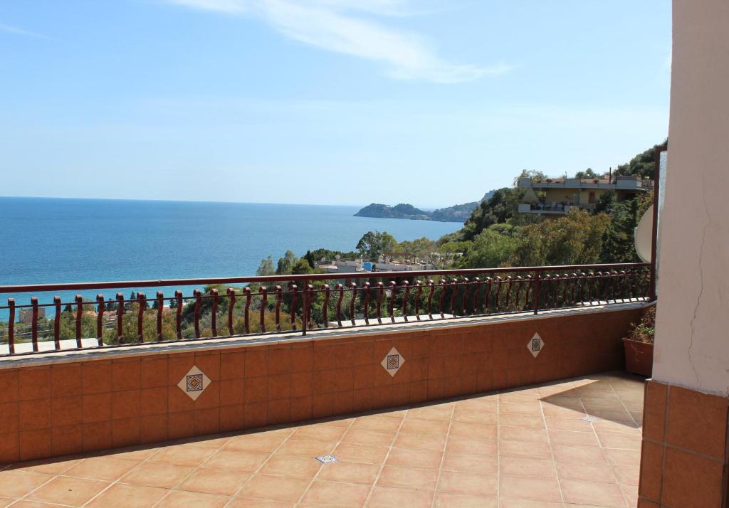 a balcony with a view of the ocean at CasaLella in Letojanni
