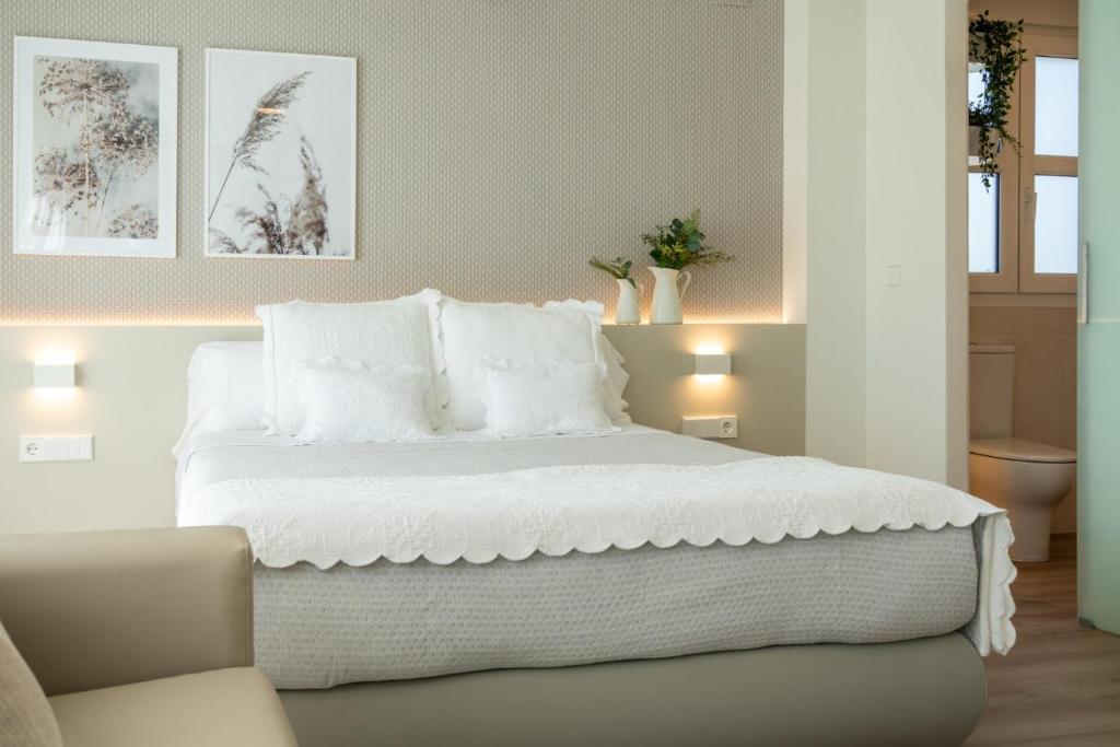 Postel nebo postele na pokoji v ubytování Hotel Rural Tierras del Cid