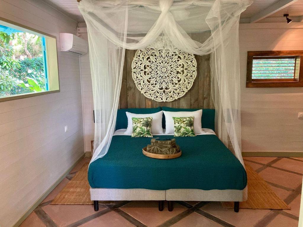 Postel nebo postele na pokoji v ubytování TropicAngel ECOLODGE de Charme