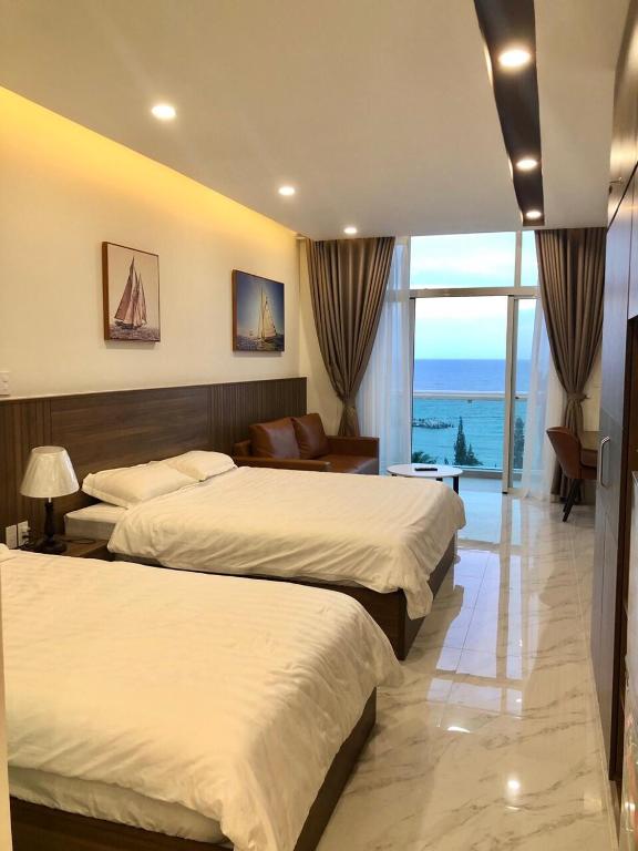 Giường trong phòng chung tại Sealiks Ocean vita muine C326