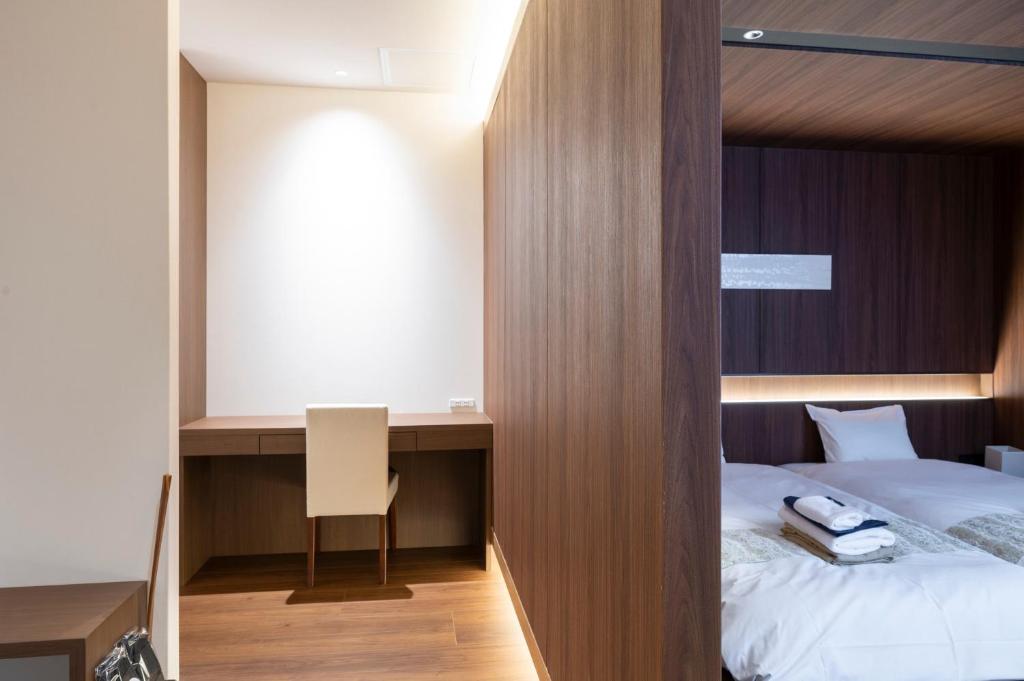 Postel nebo postele na pokoji v ubytování Torifito Hotel & Pod Kanazawa