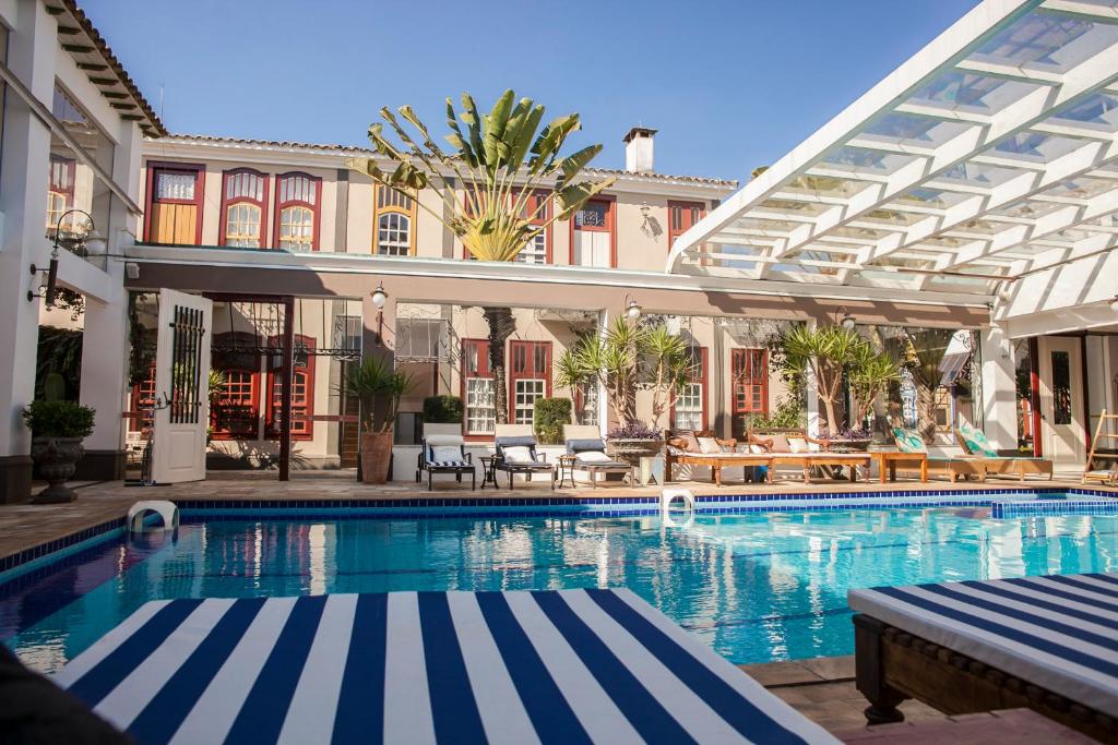 an image of a swimming pool at a hotel at Pousada Pequena Tiradentes in Tiradentes