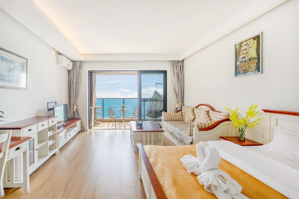 Postel nebo postele na pokoji v ubytování HuiZhou HuaYangNian Seaview Guesthouse