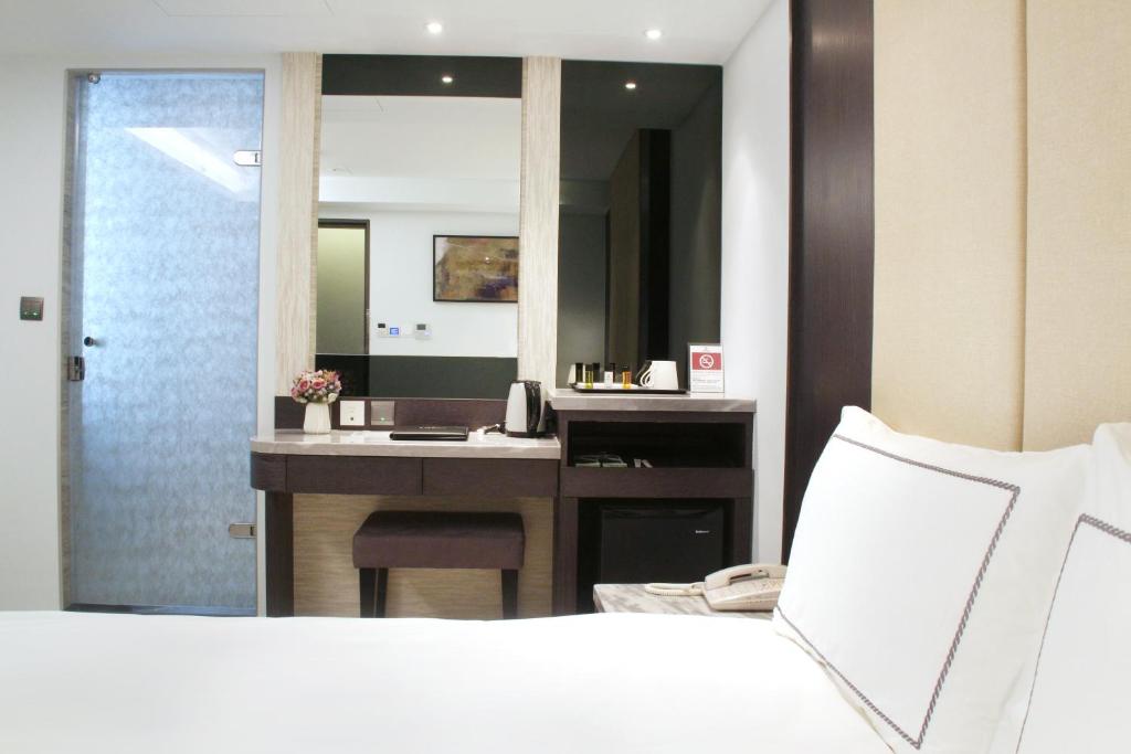 Postel nebo postele na pokoji v ubytování Gamalan Spring Hotel