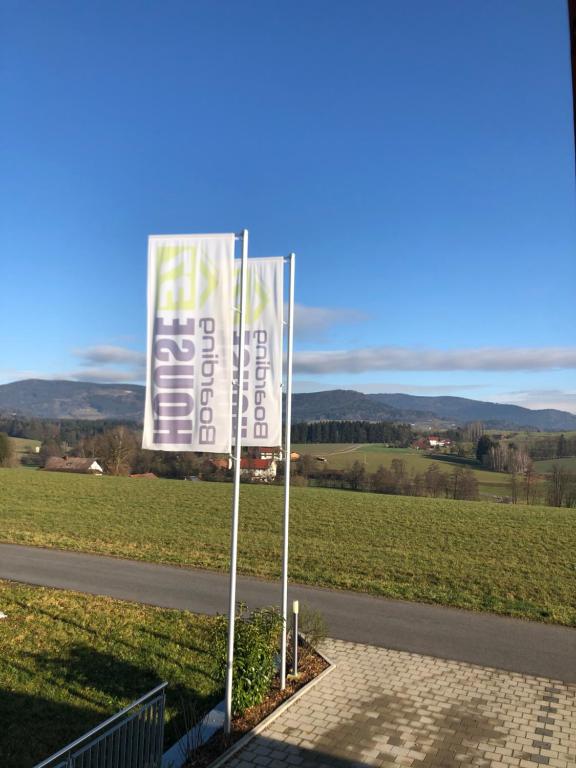 a sign on the side of a road next to a field at Boardinghouse37 in Schwarzach