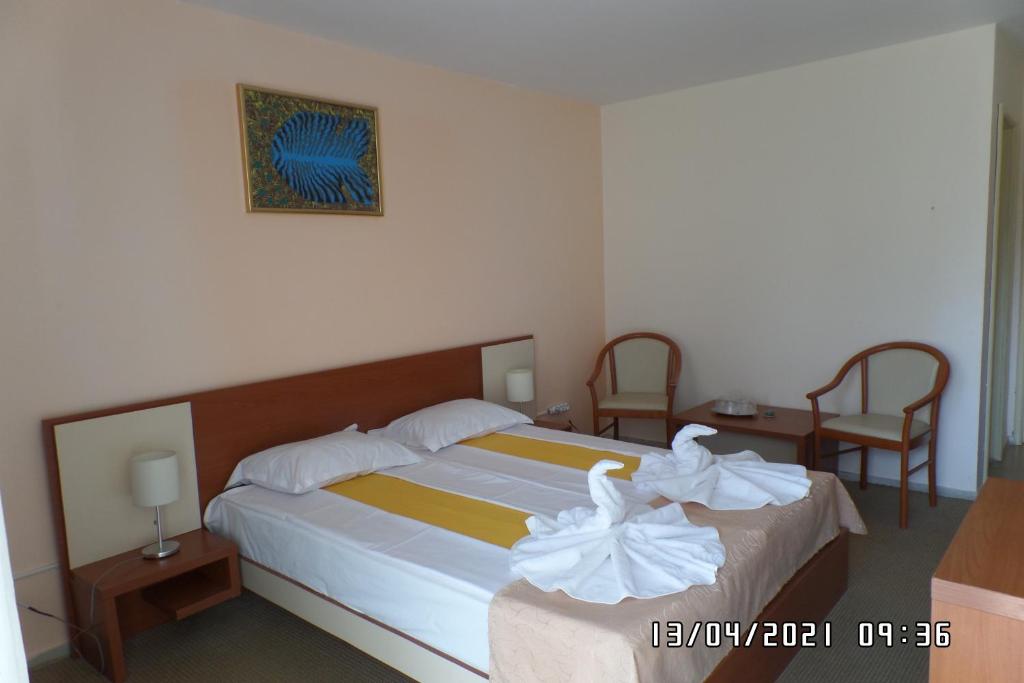 Postel nebo postele na pokoji v ubytování Hotel Metropol