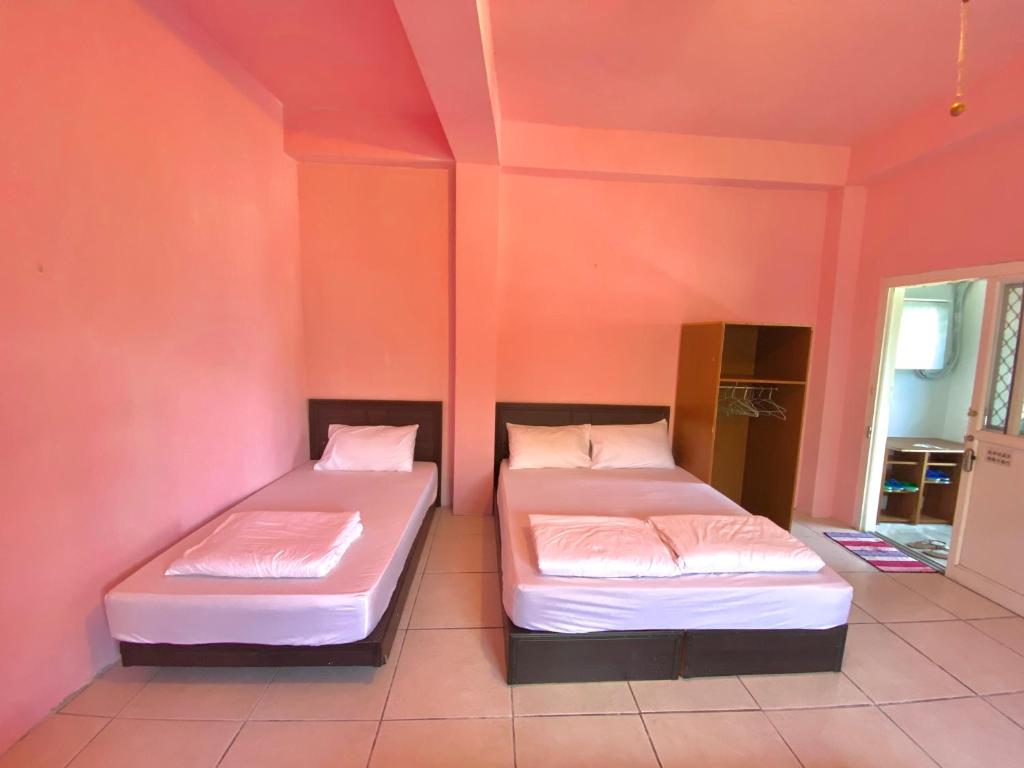 Postel nebo postele na pokoji v ubytování DoDoWu Homestay
