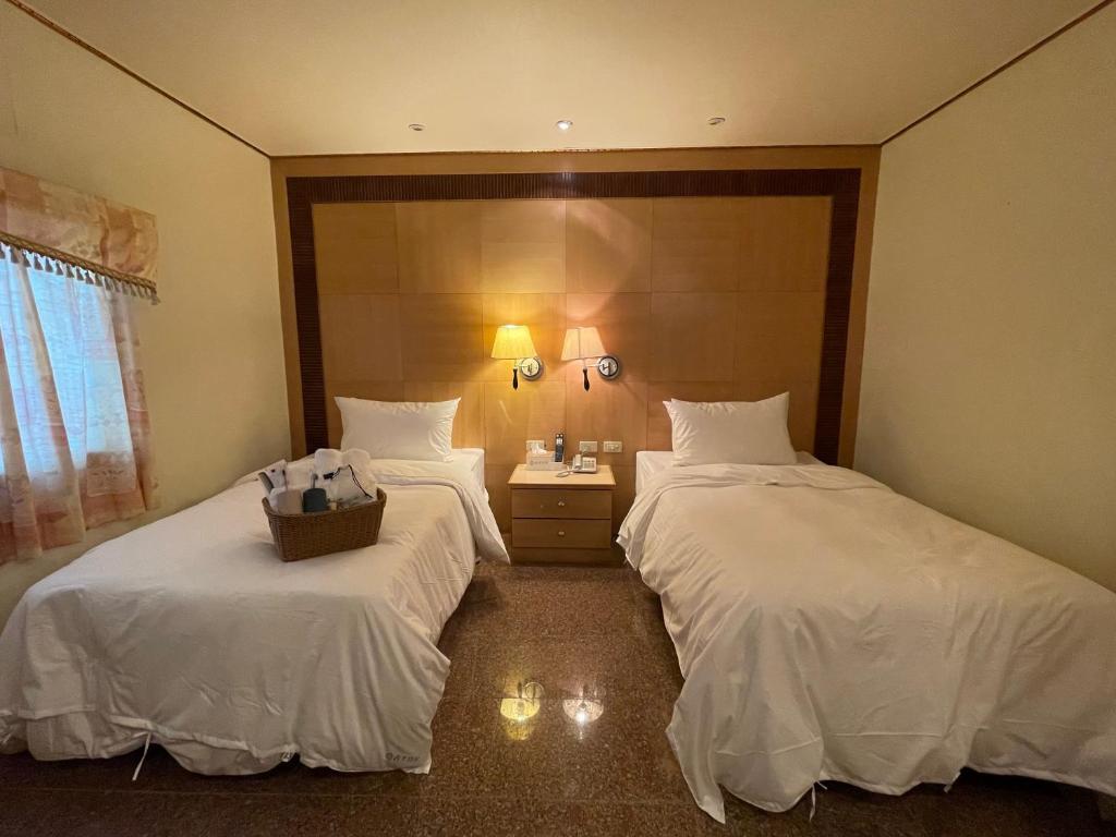 Postel nebo postele na pokoji v ubytování Shexia Liyu Hot Spring