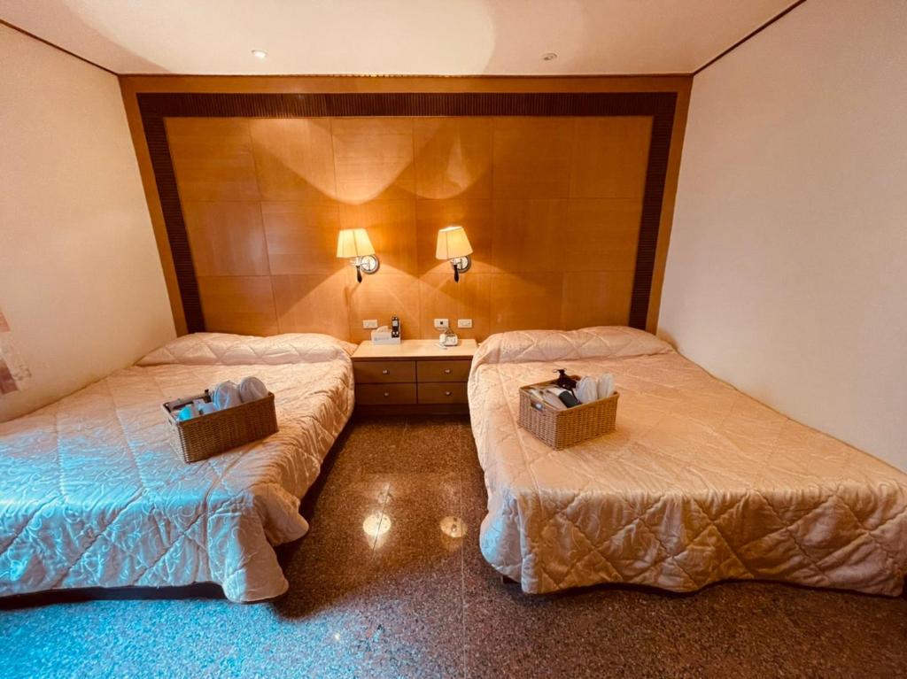 Postel nebo postele na pokoji v ubytování Shexia Liyu Hot Spring