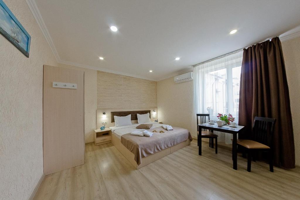Postel nebo postele na pokoji v ubytování Apart-Hotel Poseidon
