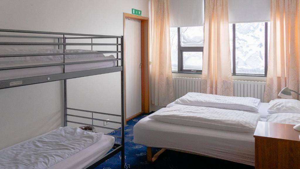 Postel nebo postele na pokoji v ubytování Hótel Dalvík