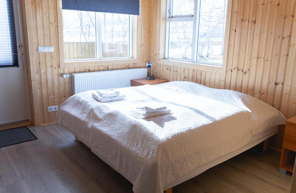Postel nebo postele na pokoji v ubytování Hótel Dalvík