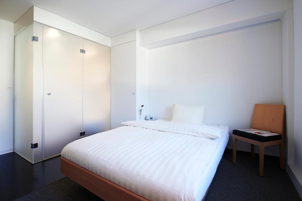 Postel nebo postele na pokoji v ubytování Hotel Weiss Kreuz