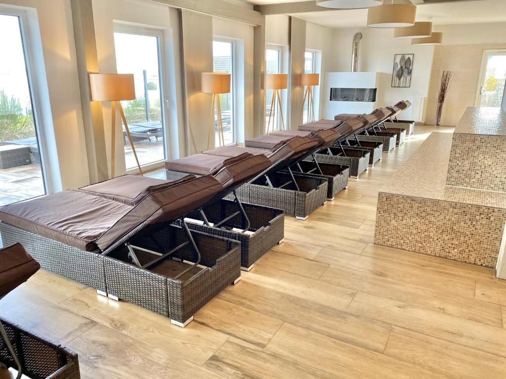 a row of chairs lined up in a waiting room at mönchgut living & spa in Gager