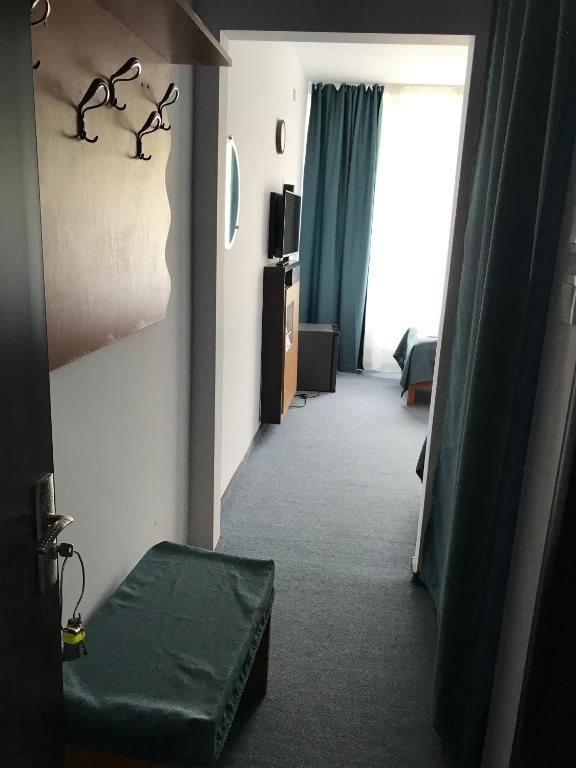 Postel nebo postele na pokoji v ubytování Hotel Lebăda