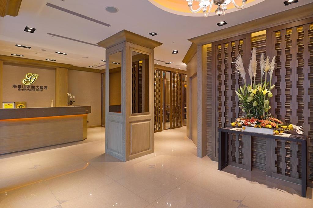 a lobby of a hotel with a wine cellar at Green World Sansui in Taipei