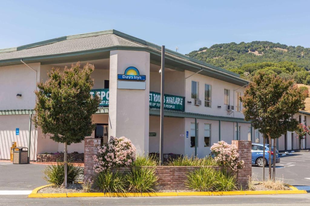 a hotel with a sign on the front of it at Days Inn by Wyndham Novato/San Francisco in Novato