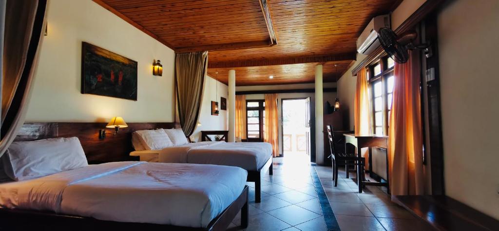 Voodi või voodid majutusasutuse Jinja Nile Resort toas