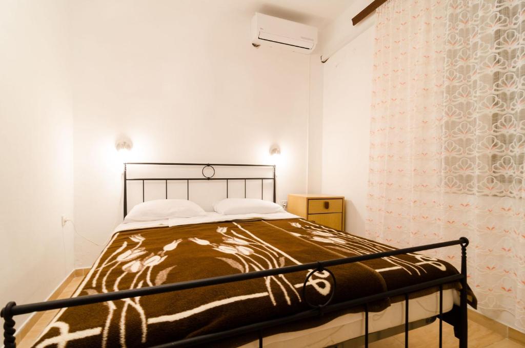 Postel nebo postele na pokoji v ubytování Guest House Kiko