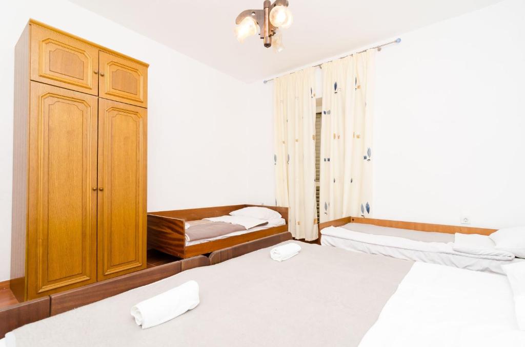 Postel nebo postele na pokoji v ubytování Guest House Kiko