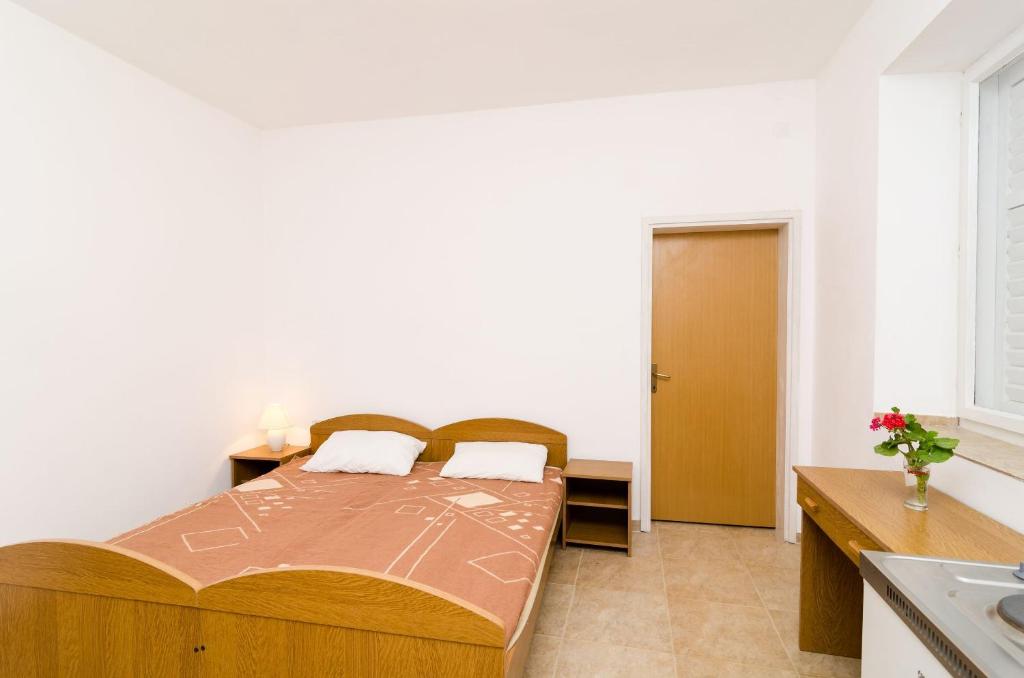 Postel nebo postele na pokoji v ubytování Guest House Kiko