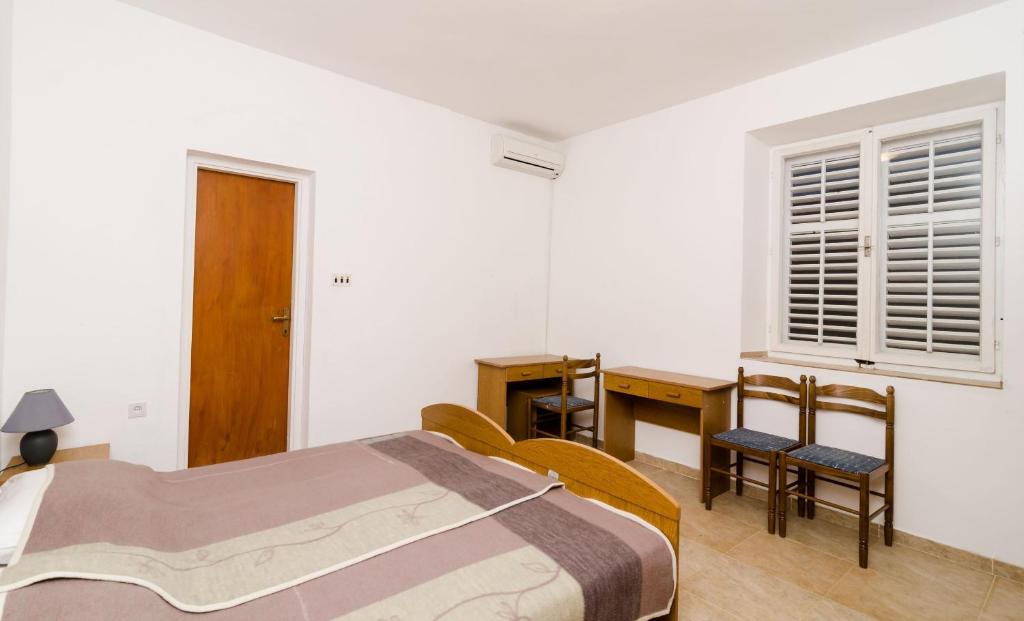 Postel nebo postele na pokoji v ubytování Guest House Kiko