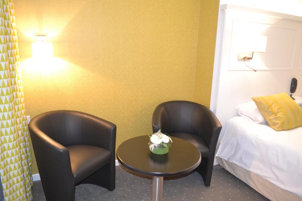 Postel nebo postele na pokoji v ubytování Logis Hôtel & Restaurant - Les Hauts de Montreuil